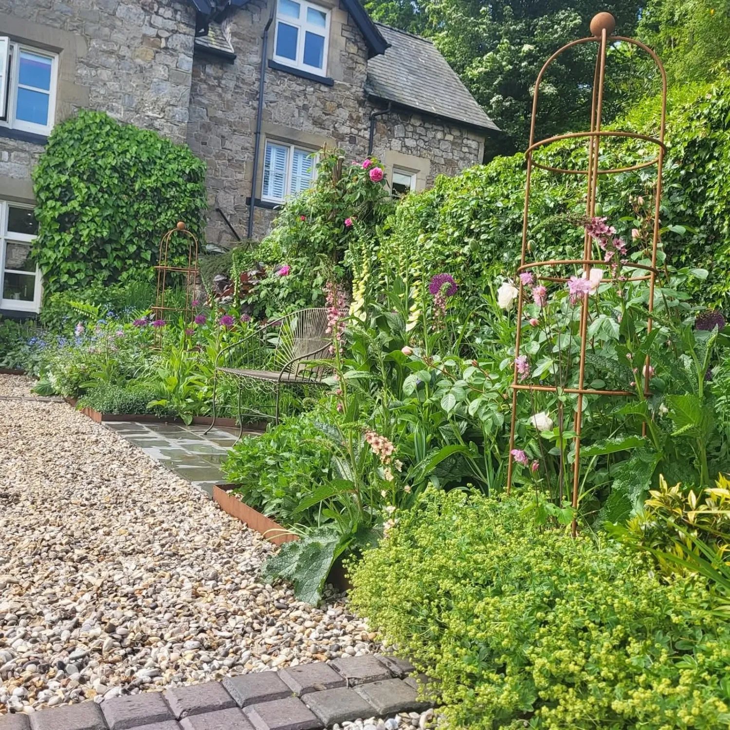 Mature flower borders in a landscaped garden
