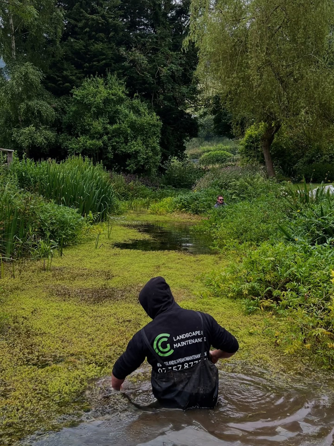CG team member carrying out fishery and pond maintenance